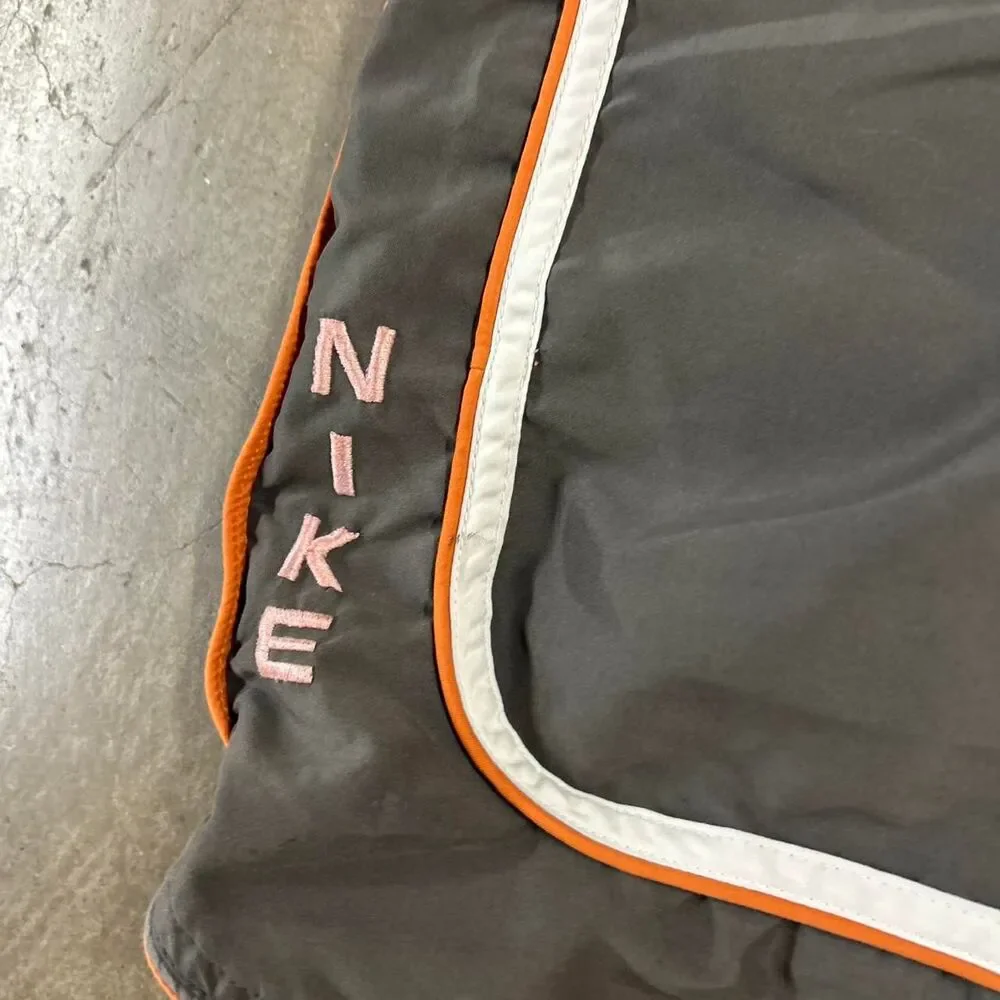 Y2K Nike gray swim shorts with white and orange stripes